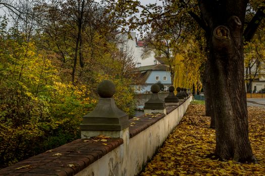 Autumn dawn in historic Prague at Charles Bridge over the Vltava River. Prague, ENESCO monument, Czech Republic