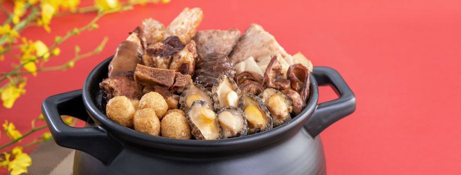 Traditional food of Chinese lunar new year, Buddha jumps over the wall, Chinese Soup Casserole dish, Buddha's Temptation, named Fo Tiao Qiang, close up.