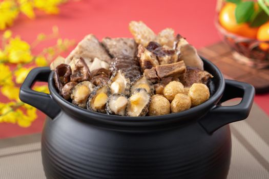 Traditional food of Chinese lunar new year, Buddha jumps over the wall, Chinese Soup Casserole dish, Buddha's Temptation, named Fo Tiao Qiang, close up.