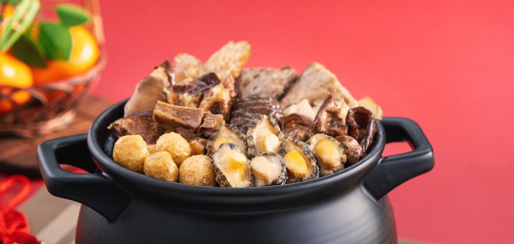 Traditional food of Chinese lunar new year, Buddha jumps over the wall, Chinese Soup Casserole dish, Buddha's Temptation, named Fo Tiao Qiang, close up.