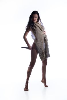 Young beautiful woman with a knife on a studio background