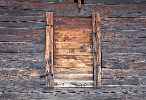 Door in a very old cabin in Switzerland, not in use anymore