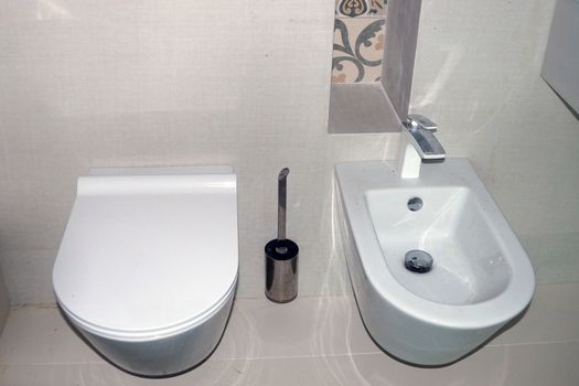 bathroom in white style, toilet and bidet.