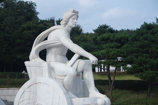 CHUNCHEON, SOUTH KOREA- October-03, 2020: White marble stone statue of sitting Poseidon or Neptune