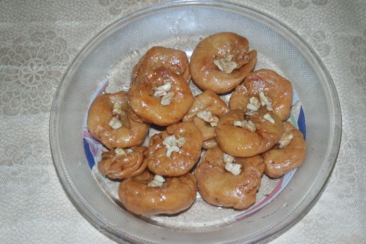 Closeup of delicious and tasty Asian sweet dish called balu shahi or baloshahi or balushahi. This dish is street sweet found in Pakistan India and Bangladesh and served in the festivities.