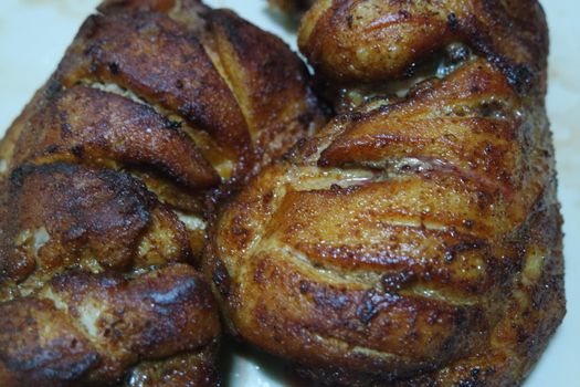 Fried, grilled baked chicken pieces with marinated spices on it. Tasty delicious fried chicken barbecue