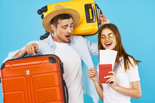 Young couple with suitcases tourism travel passport and plane ticket fun family