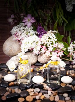 Aromatherapy, spa, beauty treatment and wellness background with massage stone, flowers, burning candles... spa concept