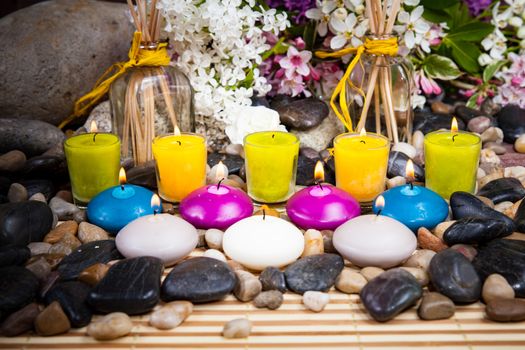 Aromatherapy, spa, beauty treatment and wellness background with massage stone, flowers, burning candles... spa concept