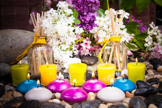 Aromatherapy, spa, beauty treatment and wellness background with massage stone, flowers, burning candles... spa concept