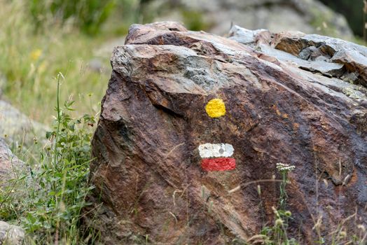 GR 11 signal in Coma Pedrosa Refuge at 2266 meters of altitude in Andorra Pyrenees in summer 2020.