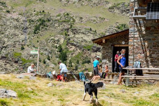 Coma Pedrosa, Andorra : 02 August 2020 : Group of Tourist in Coma Pedrosa refuge at 2266 meters of altitude in Andorra Pyrenees in summer 2020.