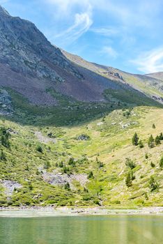 Mountain lake Estany de les Truites in Andorra Pyrenees, La Massana, Refugi de Coma Pedrosa