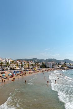 Sitges, Catalonia, Spain: July 28, 2020: People in the beach in Sitges in summer 2020.