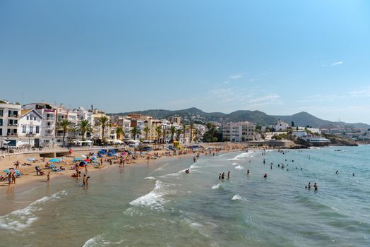 Sitges, Catalonia, Spain: July 28, 2020: People in the beach in Sitges in summer 2020.