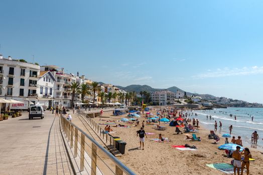 Sitges, Catalonia, Spain: July 28, 2020: People in the beach in Sitges in summer 2020.