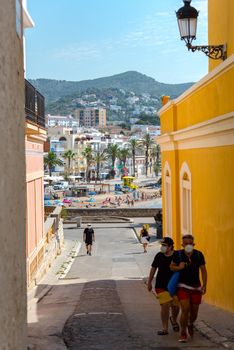 Sitges, Catalonia, Spain: July 28, 2020: People walking in the old town in Sitges in summer 2020. walking on the beach in Sitges in summer 2020.