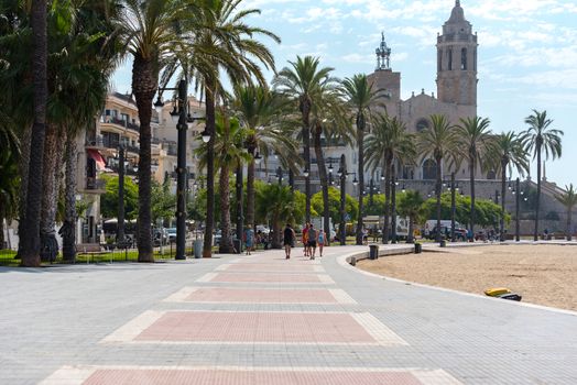 Sitges, Catalonia, Spain: July 28, 2020: People on the Paseo Maritimo in the city of Sitges in the summer of 2020.