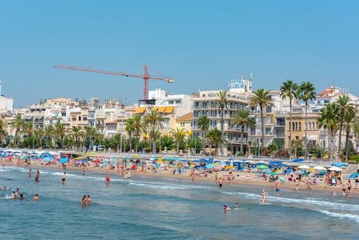 Sitges, Catalonia, Spain: July 28, 2020: People in the beach in Sitges in summer 2020.