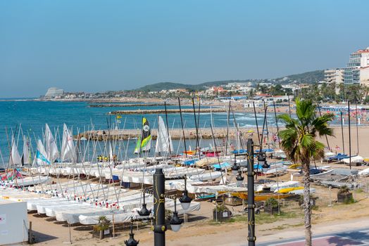 Sitges, Catalonia, Spain: July 28, 2020: People in the beach in Sitges in summer 2020.