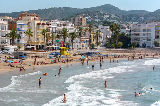 Sitges, Catalonia, Spain: July 28, 2020: People in the beach in Sitges in summer 2020.