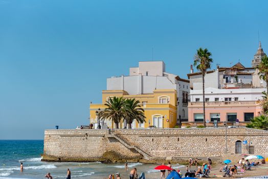 Sitges, Catalonia, Spain: July 28, 2020: People in the beach in Sitges in summer 2020.