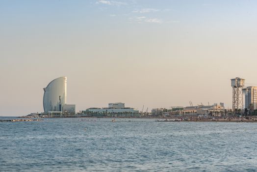 BARCELONA, SPAIN -28 july 2020- Designed by architect Ricardo Bofill, the modern skyscraper W Hotel, nicknamed Sail Hotel (hotel Vela) is located in the Barceloneta neighborhood.