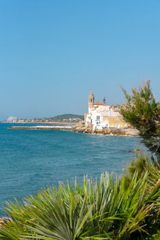 Sandy beach and historic old town in the Mediterranean complex Sitges near Barcelona, ​​Costa Dorada, Catalonia, Spain