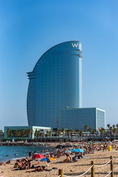 Barcelona, Spain - July 28 2020:  People in the Barceloneta Beach after COVID 19 La Barceloneta in Barcelona, Spain.