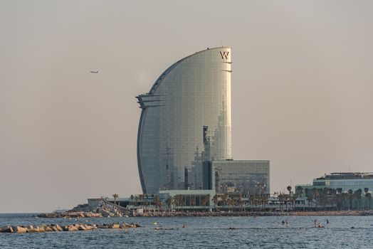 BARCELONA, SPAIN -28 july 2020- Designed by architect Ricardo Bofill, the modern skyscraper W Hotel, nicknamed Sail Hotel (hotel Vela) is located in the Barceloneta neighborhood.