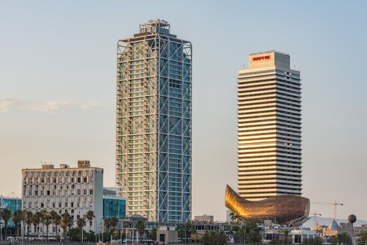 Barcelona , Spain - 28 july, 2020 : Mapfre tower and Arts hotel skyscrapers illuminated at night