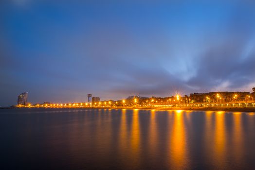 Cityscape in La Barceloneta lights in the city of Barcleona in Spain.