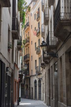 Barcelona, Spain - July 28 2020:  People walking through empty streets after COVID 19 in Barcelona, Spain.