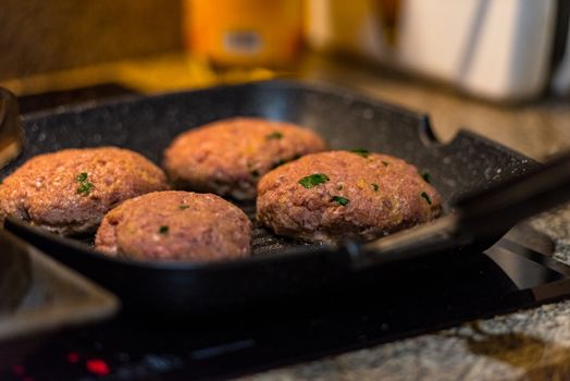 Grilled burgers with dancing flames cooked to perfection.