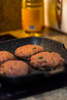 Grilled burgers with dancing flames cooked to perfection.