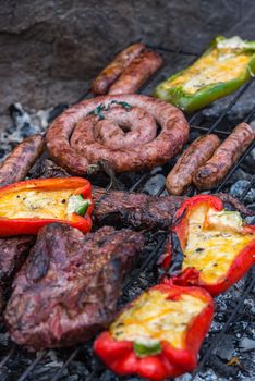 Closeup take of a traditional Argentinian and Uruguayan barbecue and peppers ehit eggs and cheese.