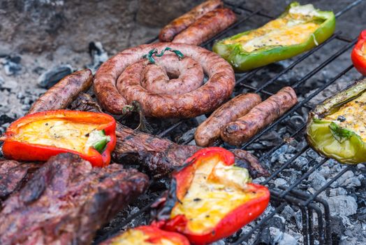 Closeup take of a traditional Argentinian and Uruguayan barbecue and peppers ehit eggs and cheese.