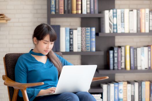 Business young asian woman freelance work on display laptop computer on chair, businesswoman check email, asia girl searching to internet communication and business concept.