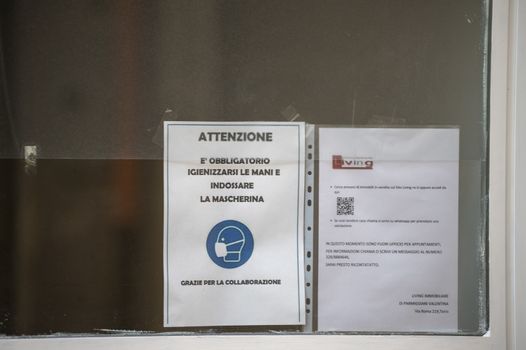 terni,italy november 11 2020:anti corona virus notice displayed in a shop