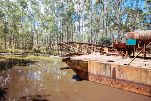 An old Dredge and Dragline which is an abandoned piece of gold mining equipment near Maldon in Victoria, Australia