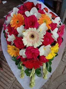 multiple colored flower bouquet closeup in shop for sell