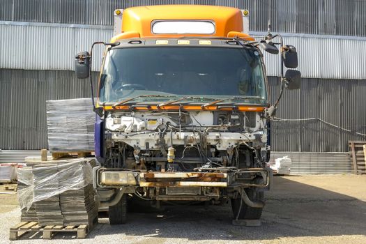 An old half-disassembled truck stands in the factory territory