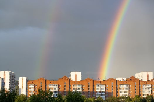 A rainbow appeared over the houses After the rain