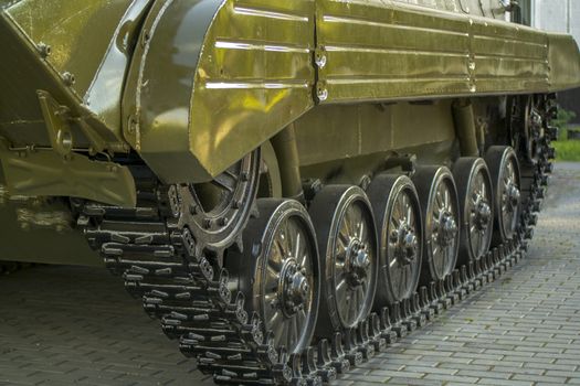 old tank track, standing by the tracks on the pavement,