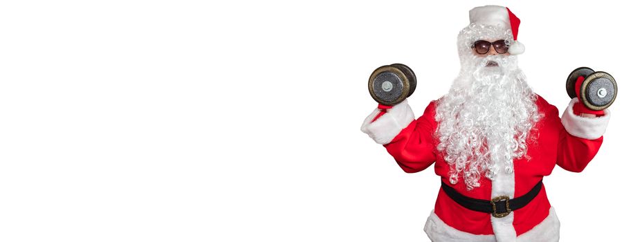 Santa Claus working out and pushing two dumbbells up in the air. Santa wearing sunglasses and a long white beard. Isolated on white background. Banner size, copy space.