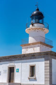 Parc Natural Cap de Creus, Spain :  8 july 2020 : Cap de Creus, natural park. Eastern point of Spain, Girona province, Catalonia. Lighthouse in  tourist destination in Costa Brava. Sunny summer day with blue sky and clouds