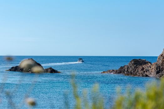 Sea landscape with Cap de Creus, natural park. Eastern point of Spain, Girona province, Catalonia. Famous tourist destination in Costa Brava. Sunny summer day with blue sky and clouds.