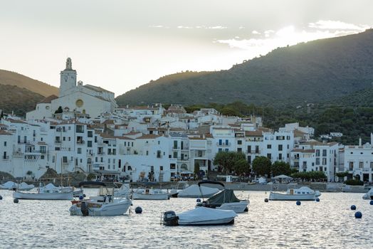 Cadaques, Spain : 07 JULY 2020 : Boats in the beach and houses of the village of Cadaques, Spain in summer on 07 july 2020.