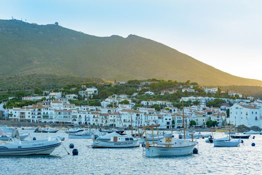 Cadaques, Spain : 07 JULY 2020 : Boats in the beach and houses of the village of Cadaques, Spain in summer on 07 july 2020.