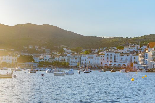 Cadaques, Spain : 07 JULY 2020 : Boats in the beach and houses of the village of Cadaques, Spain in summer on 07 july 2020.